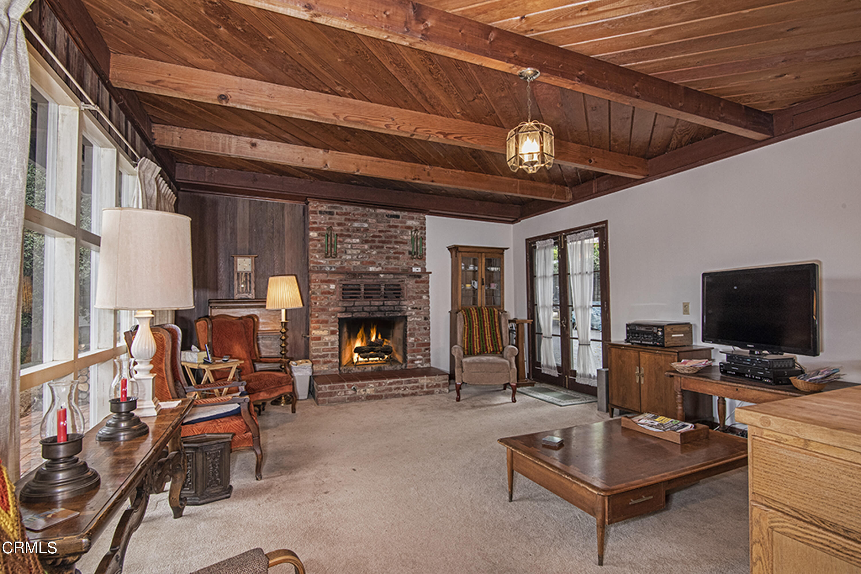 2888 Reposa Lane Altadena, CA 91001 - Photo 8 of 60 a living room with furniture a fireplace and a flat screen tv