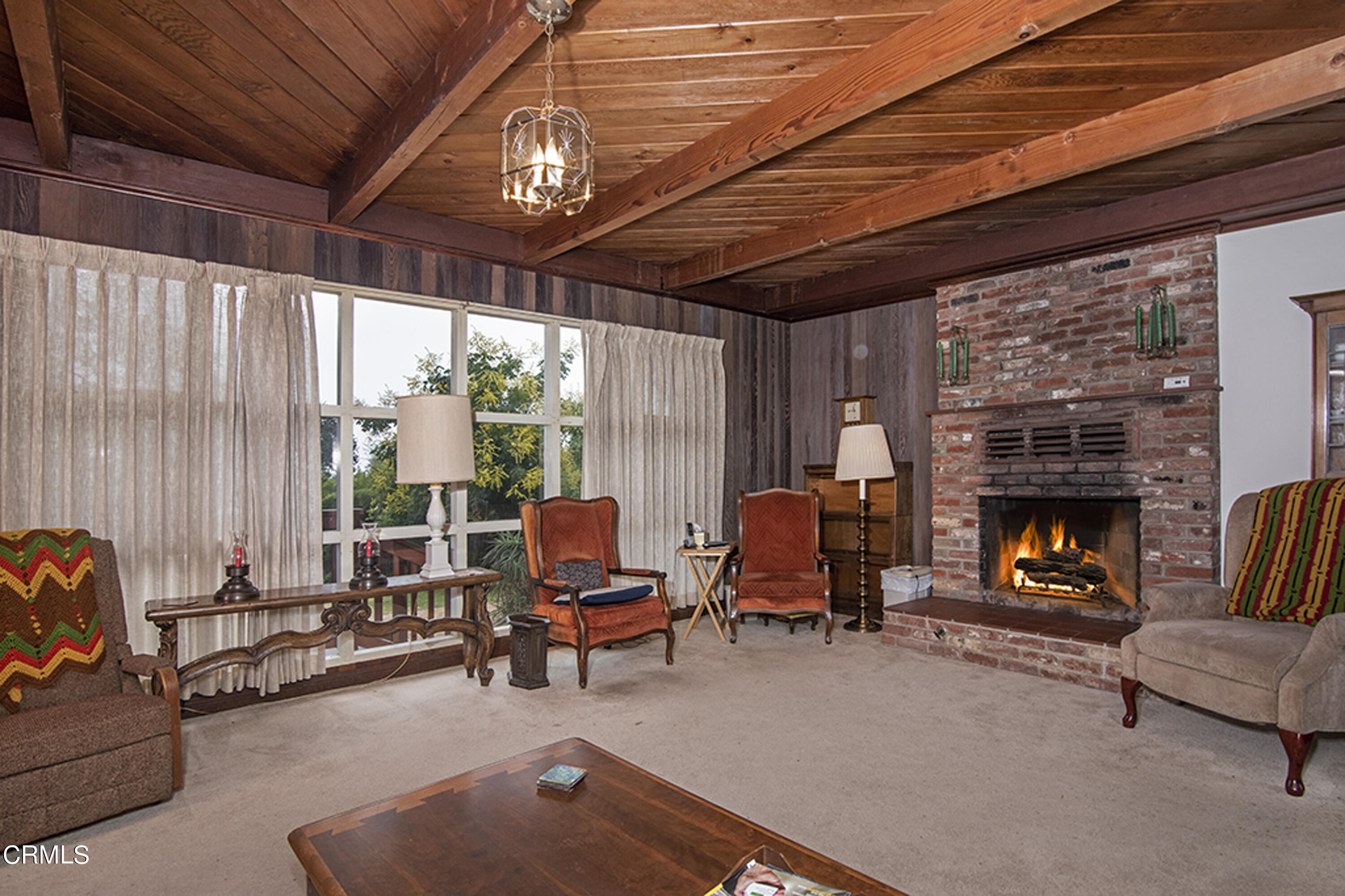 2888 Reposa Lane Altadena, CA 91001 - Photo 9 of 60 a living room with furniture and a fireplace