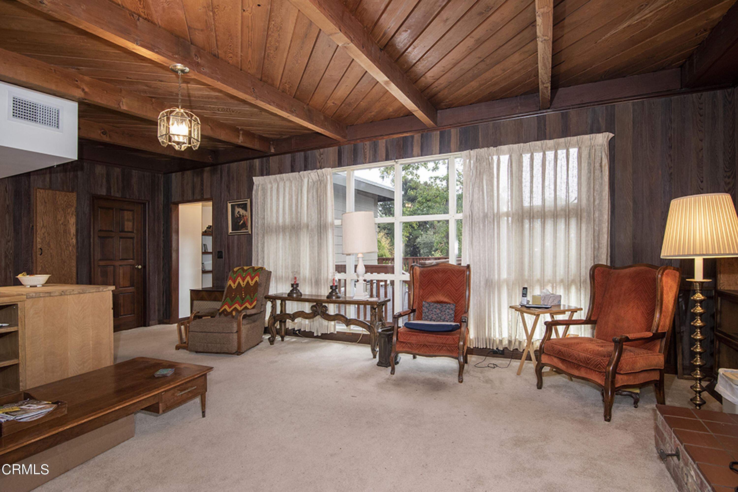 2888 Reposa Lane Altadena, CA 91001 - Photo 10 of 60 a living room with furniture and a chandelier