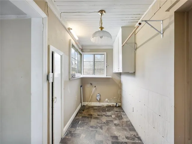 a view of a hallway with a chandelier