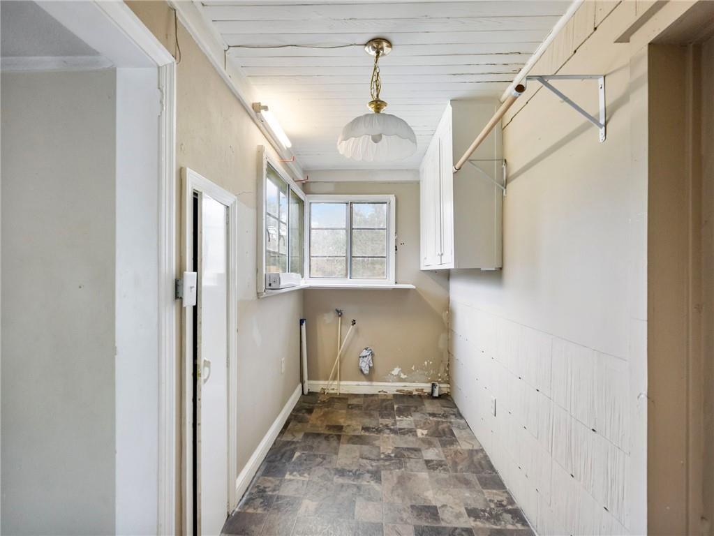 1093 Enota Avenue Northeast Gainesville, GA 30501 - Photo 14 of 47 a view of a hallway with a chandelier