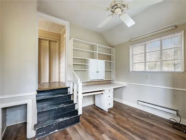 a view of a kitchen with a sink and dishwasher wooden floor