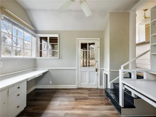 a bathroom with a double vanity sink toilet and shower