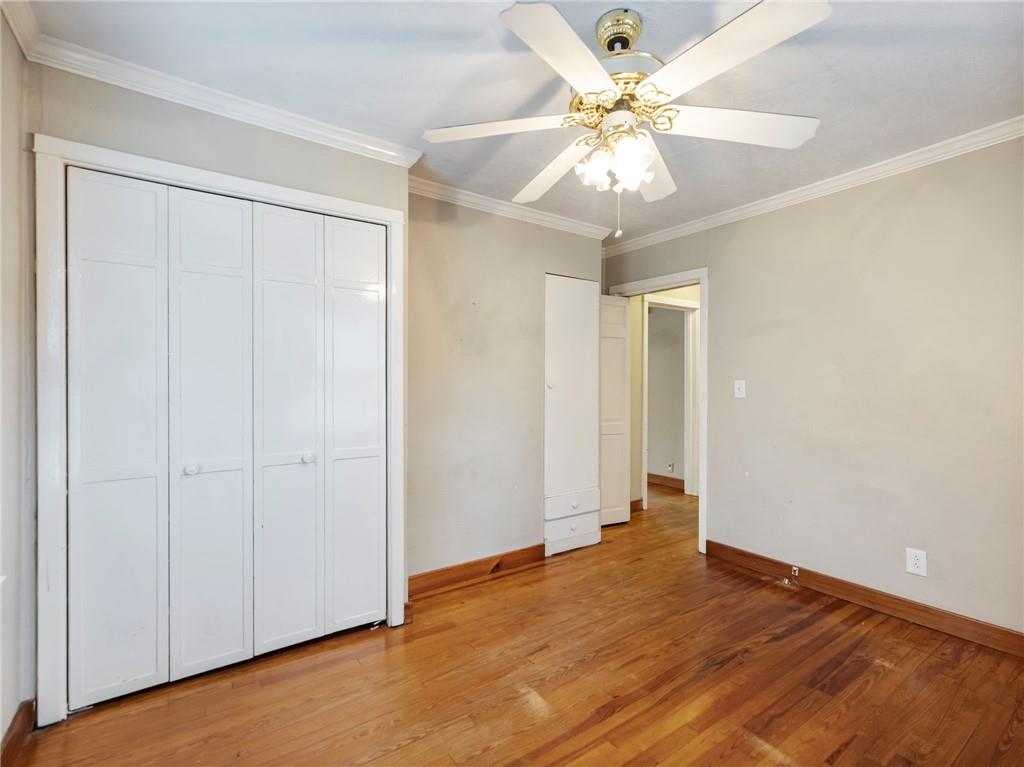 1093 Enota Avenue Northeast Gainesville, GA 30501 - Photo 20 of 47 an empty room with fan and a chandelier fan