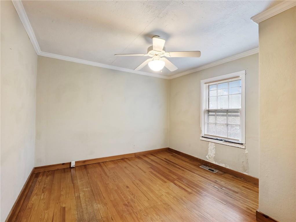 1093 Enota Avenue Northeast Gainesville, GA 30501 - Photo 24 of 47 an empty room with a window and ceiling fan