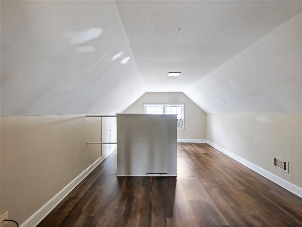 1093 Enota Avenue Northeast Gainesville, GA 30501 - Photo 29 of 47 wooden floor in an empty room with a window