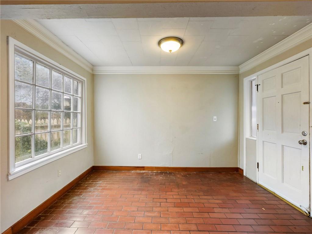 1093 Enota Avenue Northeast Gainesville, GA 30501 - Photo 3 of 47 a view of an empty room with wooden floor and a window