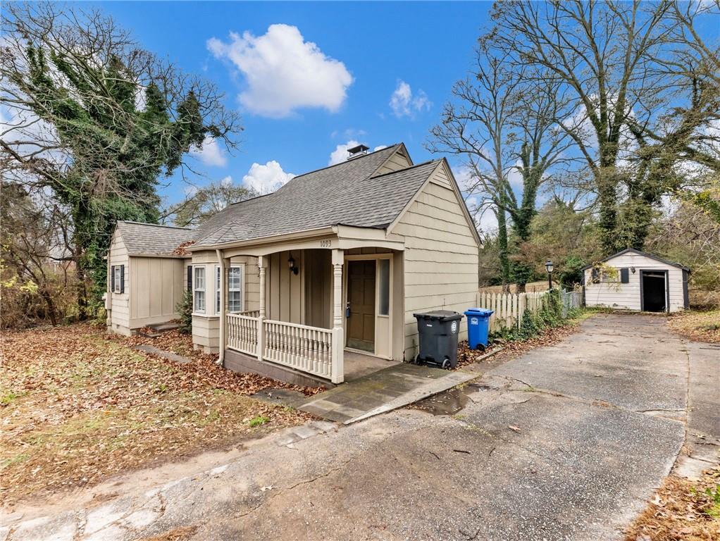 1093 Enota Avenue Northeast Gainesville, GA 30501 - Photo 37 of 47 a front view of a house with a yard and garage