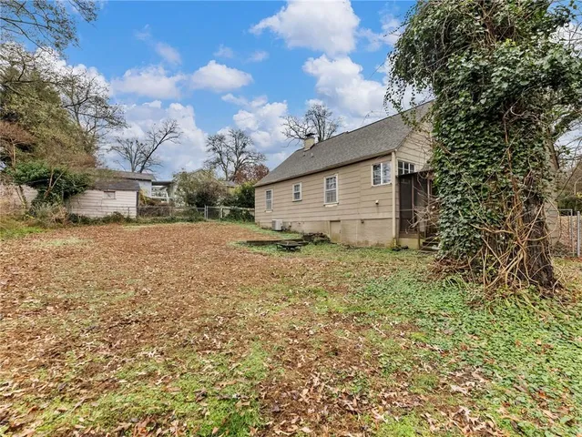 a view of a yard with large trees