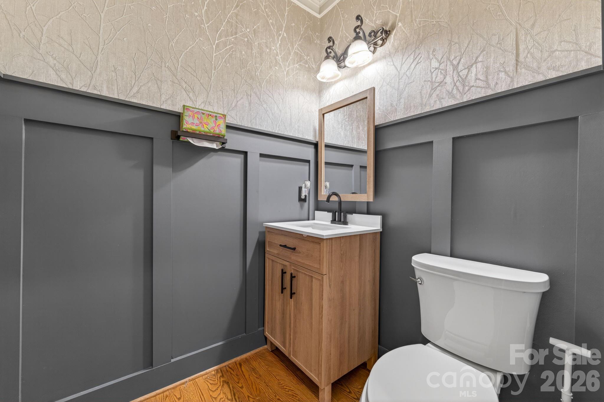 3138 Rappahannock Court, Unit 16 Matthews, NC 28104 - Photo 7 of 38 a bathroom with a toilet a sink and mirror