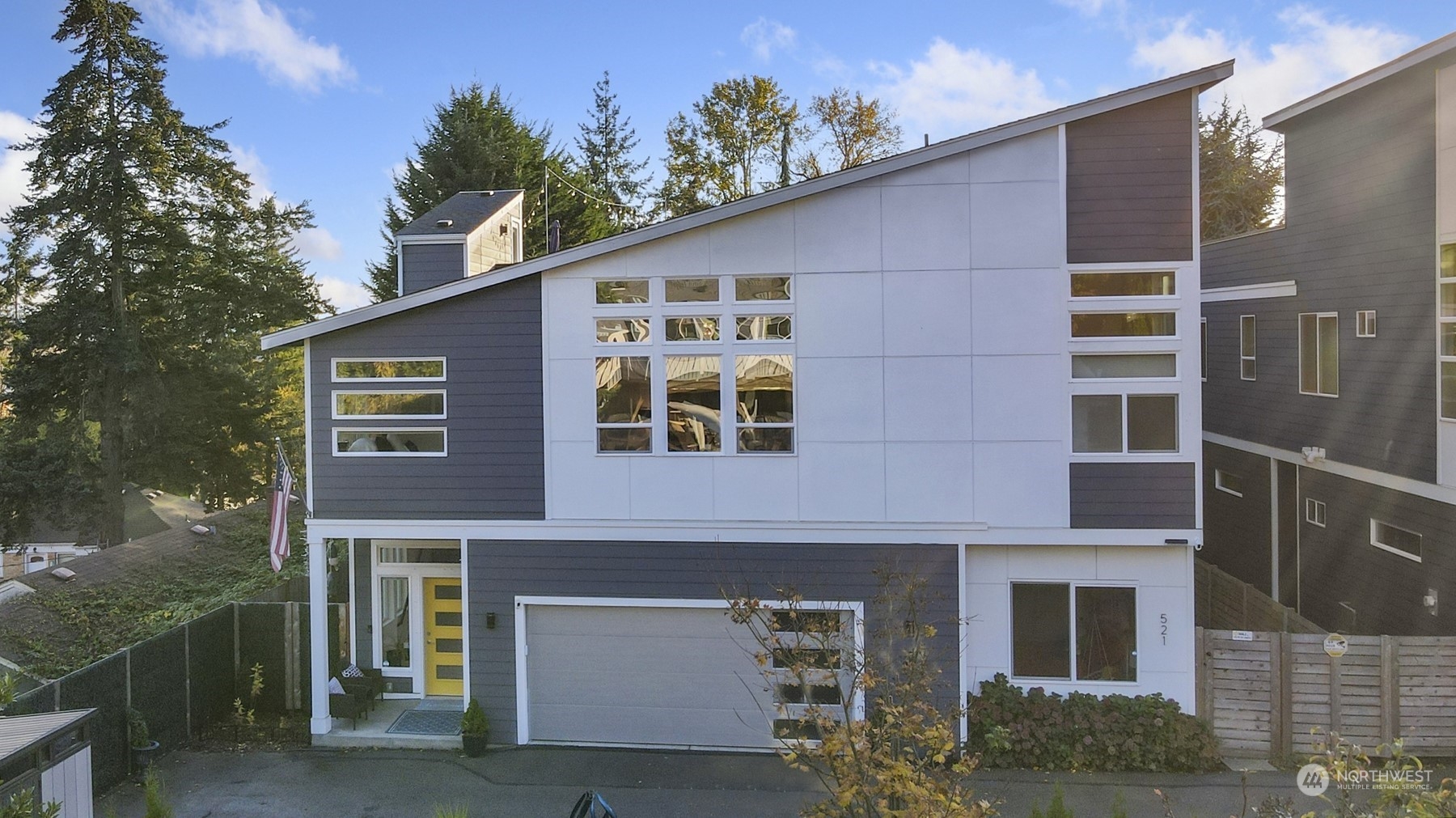 521 Southwest 3rd Place Renton, WA 98057 - Photo 2 of 32 a front view of a house with a yard