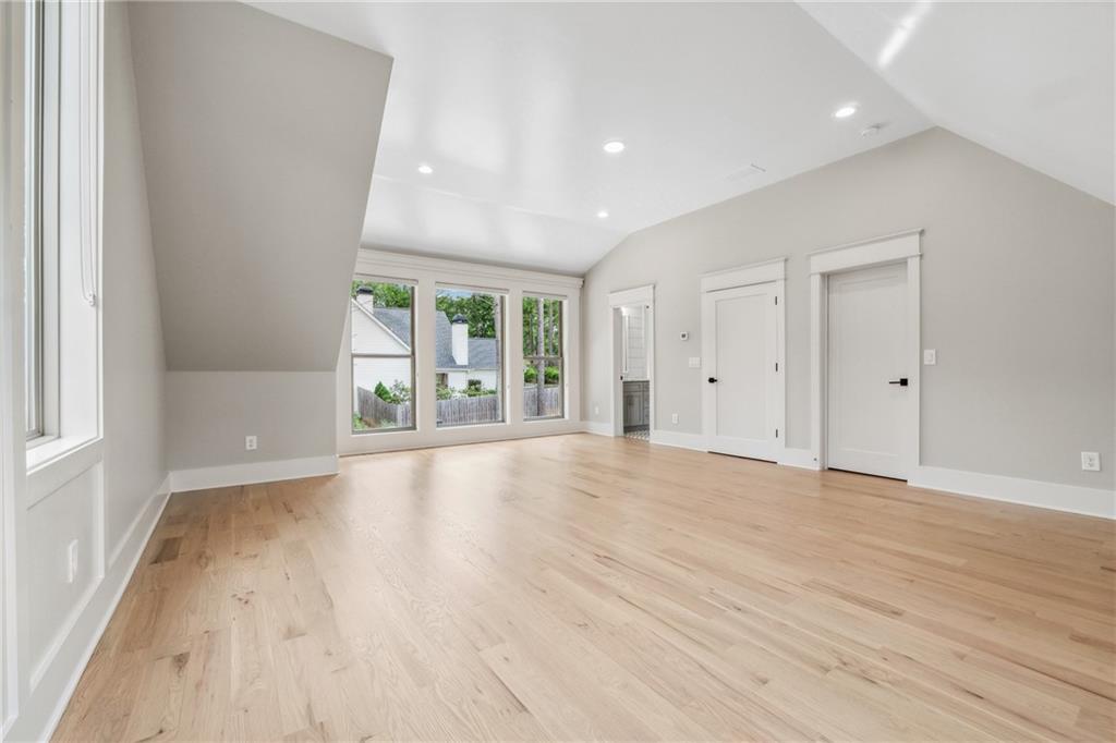 852 Tom Miller Road Bethlehem, GA 30620 - Photo 53 of 68 a view of an empty room with wooden floor and a window