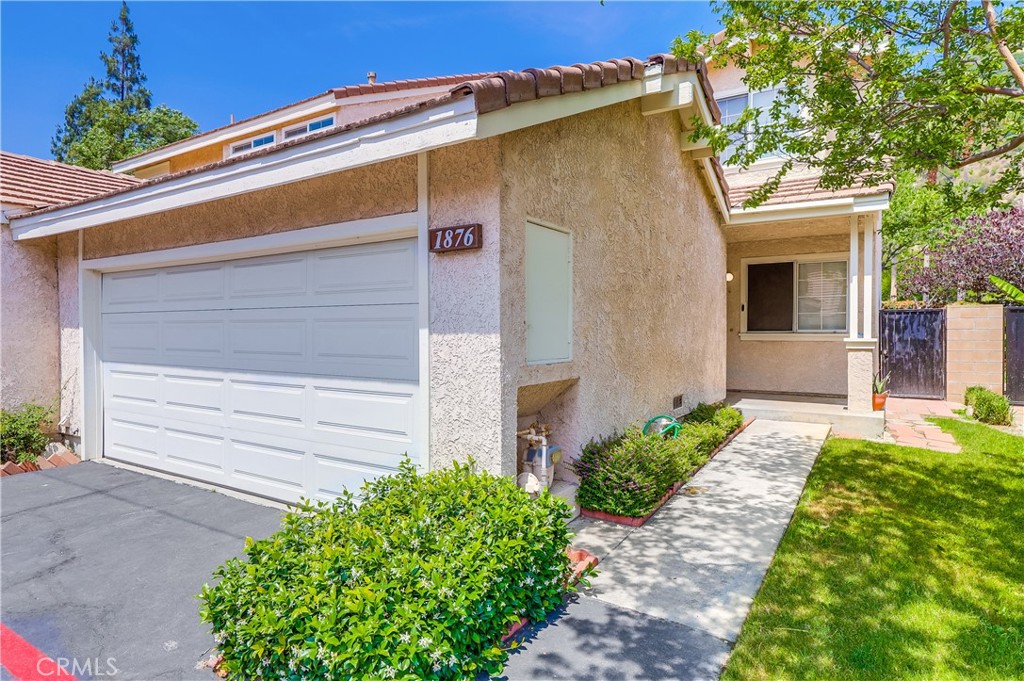 a front view of a house with a garage