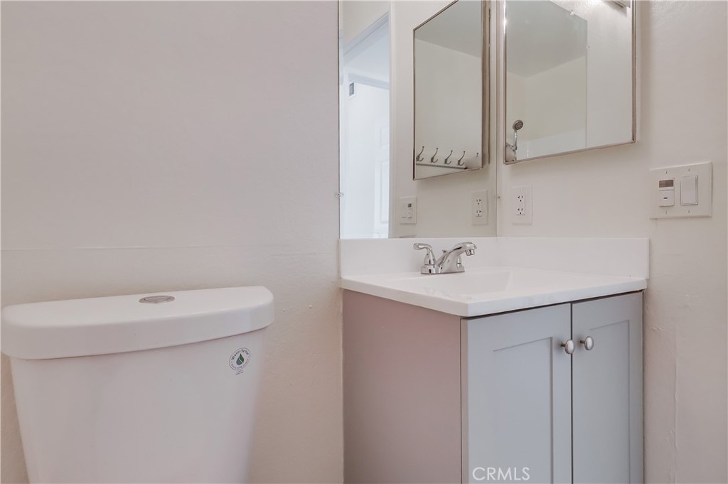 1876 Forest Drive Azusa, CA 91702 - Photo 11 of 24 a bathroom with a sink a toilet and a mirror