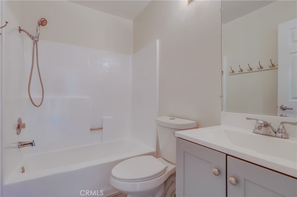 1876 Forest Drive Azusa, CA 91702 - Photo 18 of 24 a bathroom with a granite countertop toilet a sink and a bathtub
