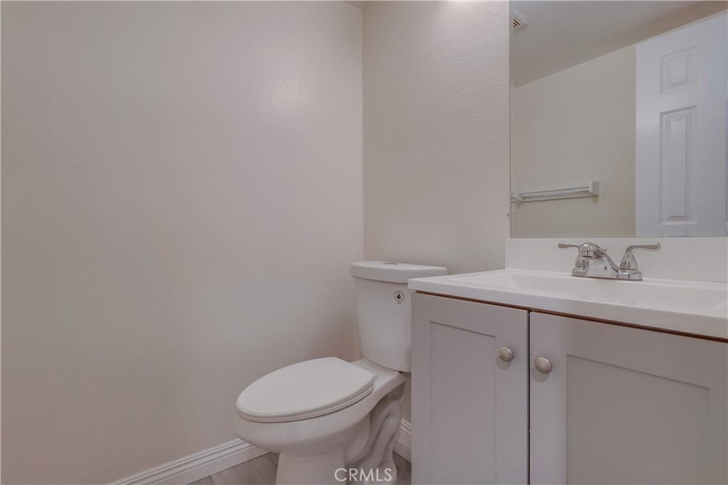 1876 Forest Drive Azusa, CA 91702 - Photo 10 of 24 a bathroom with a sink toilet and vanity