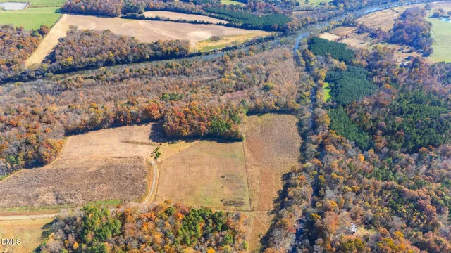 a view of a swimming pool with a yard