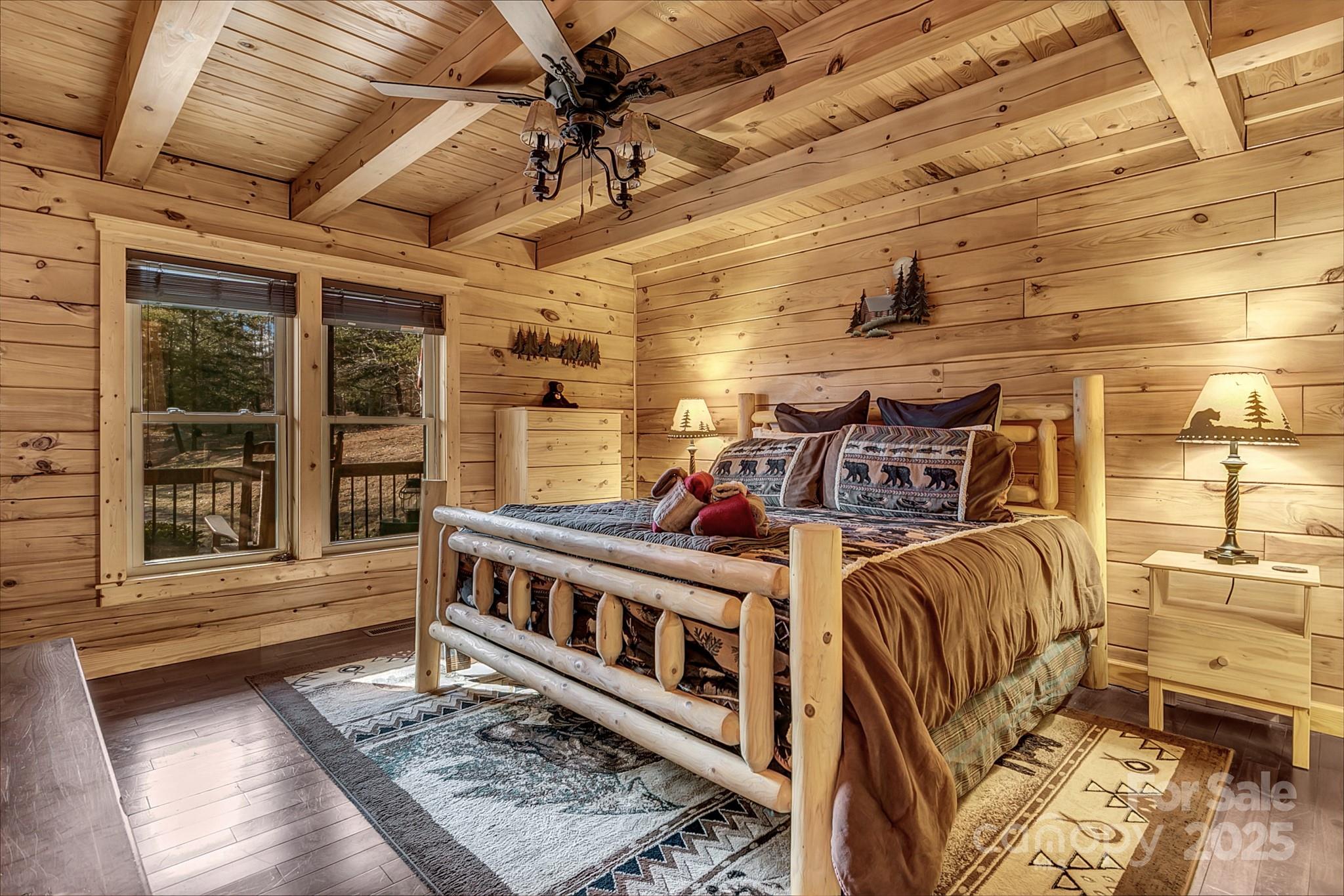 120 Sweetbriar Road North Lake Lure, NC 28746 - Photo 11 of 45 a bedroom with furniture and a window