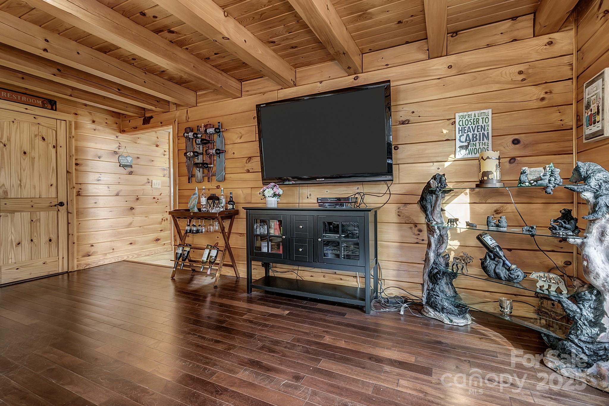 120 Sweetbriar Road North Lake Lure, NC 28746 - Photo 15 of 45 a living room with furniture and a flat screen tv