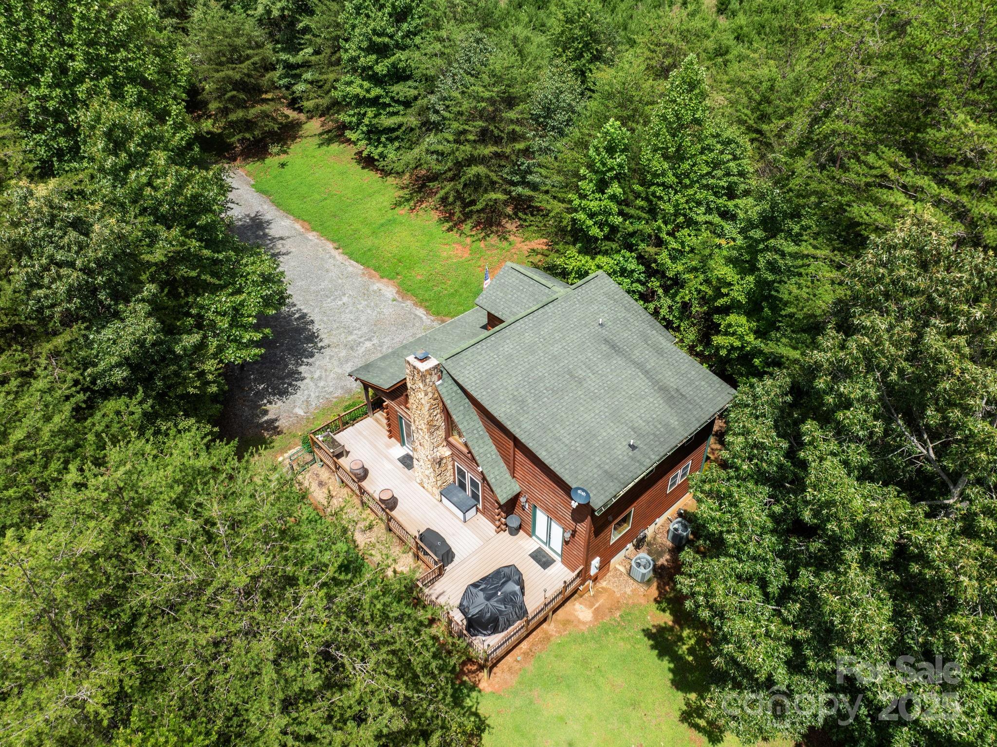 120 Sweetbriar Road North Lake Lure, NC 28746 - Photo 2 of 45 an aerial view of a house with a yard