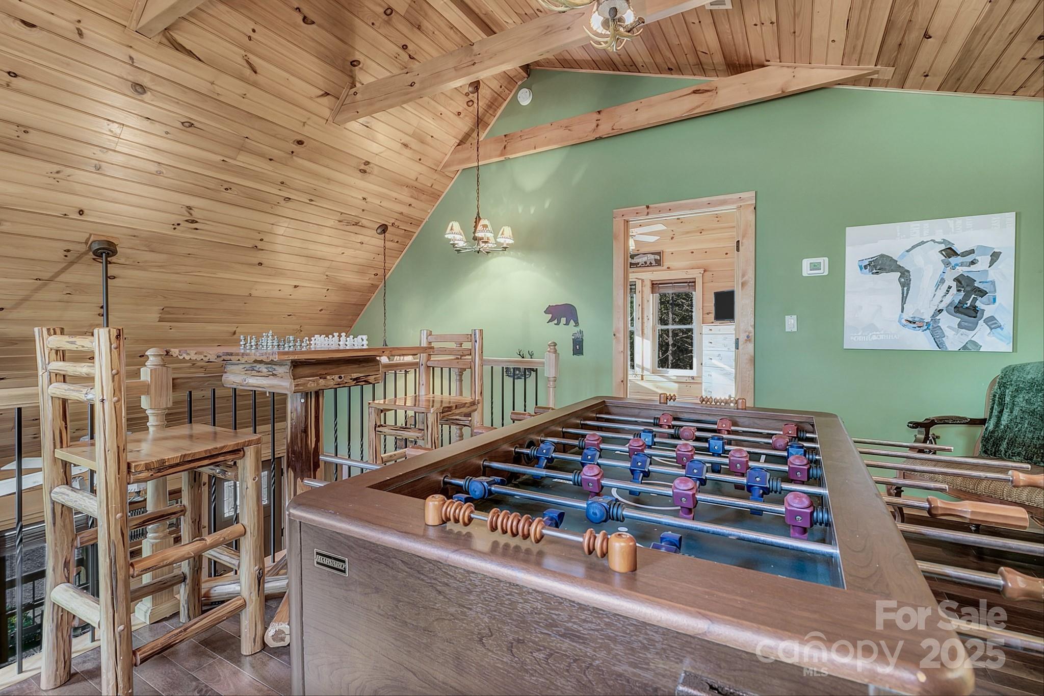 120 Sweetbriar Road North Lake Lure, NC 28746 - Photo 26 of 45 a room with lots of books and lots of furniture