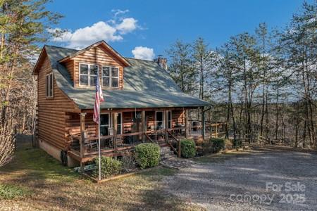 120 Sweetbriar Road North Lake Lure, NC 28746 - Photo 37 of 45 a front view of a house with a garden