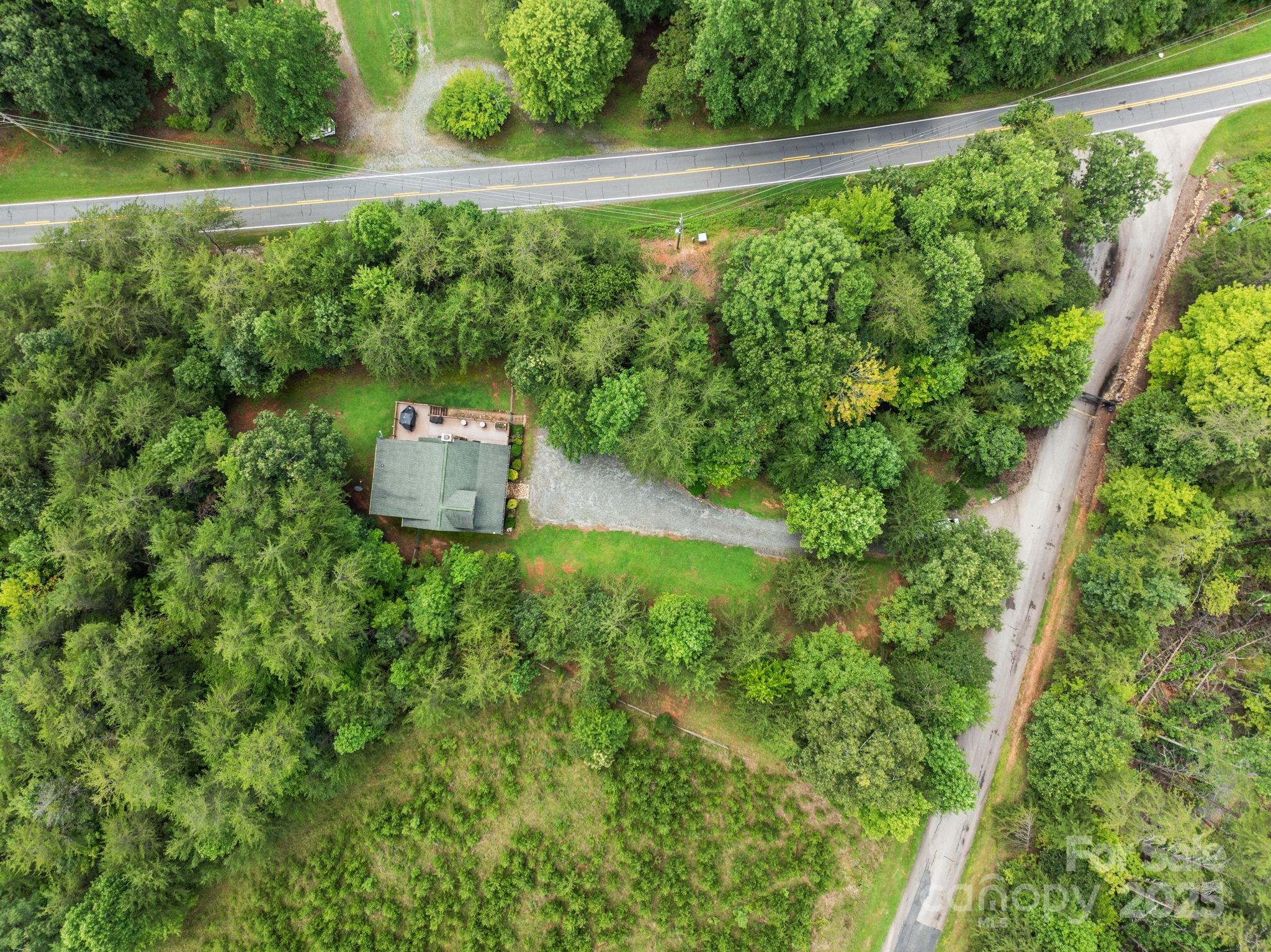 120 Sweetbriar Road North Lake Lure, NC 28746 - Photo 41 of 45 a view of a garden with a bench