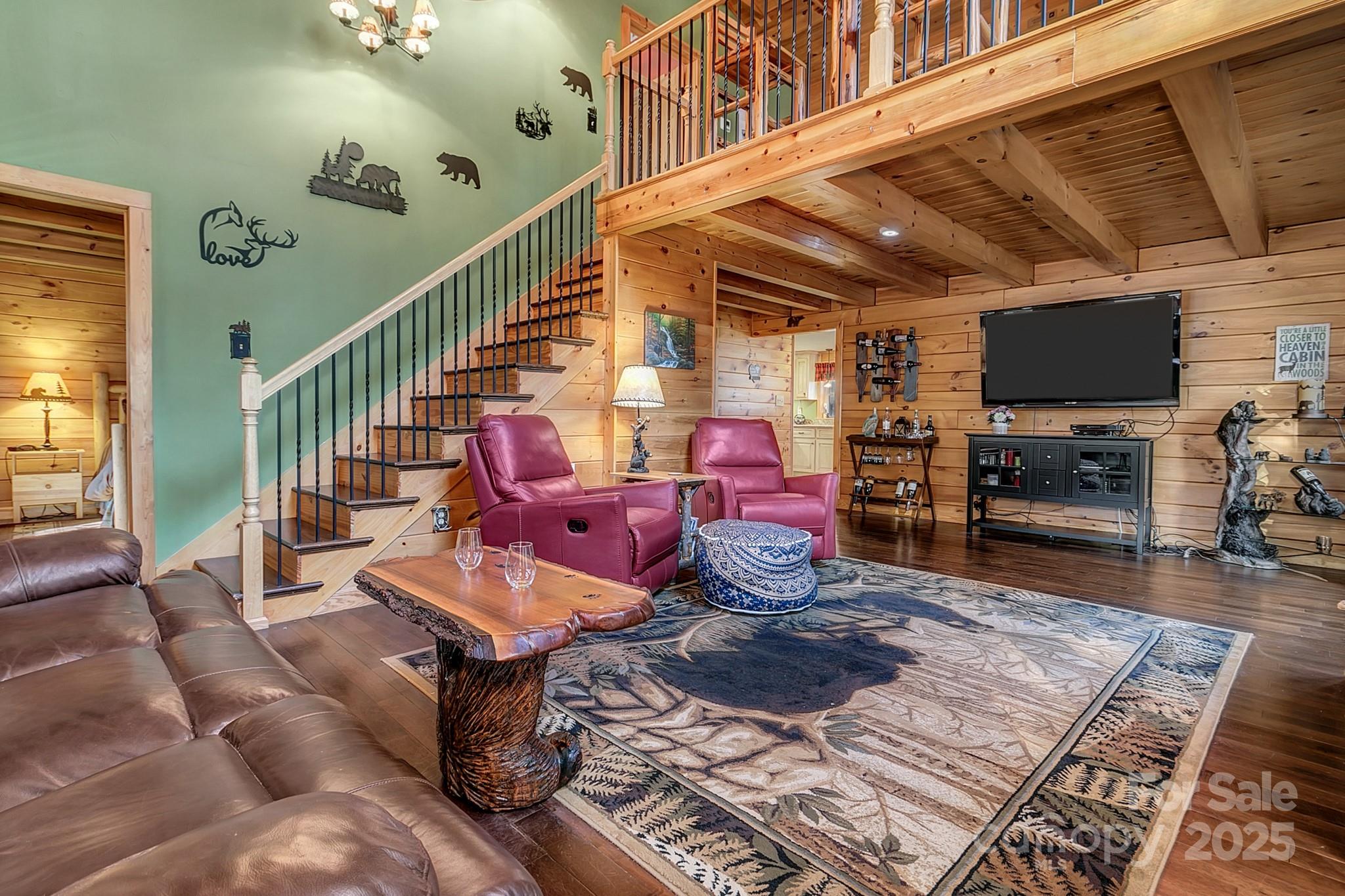 120 Sweetbriar Road North Lake Lure, NC 28746 - Photo 7 of 45 a living room with furniture and a flat screen tv