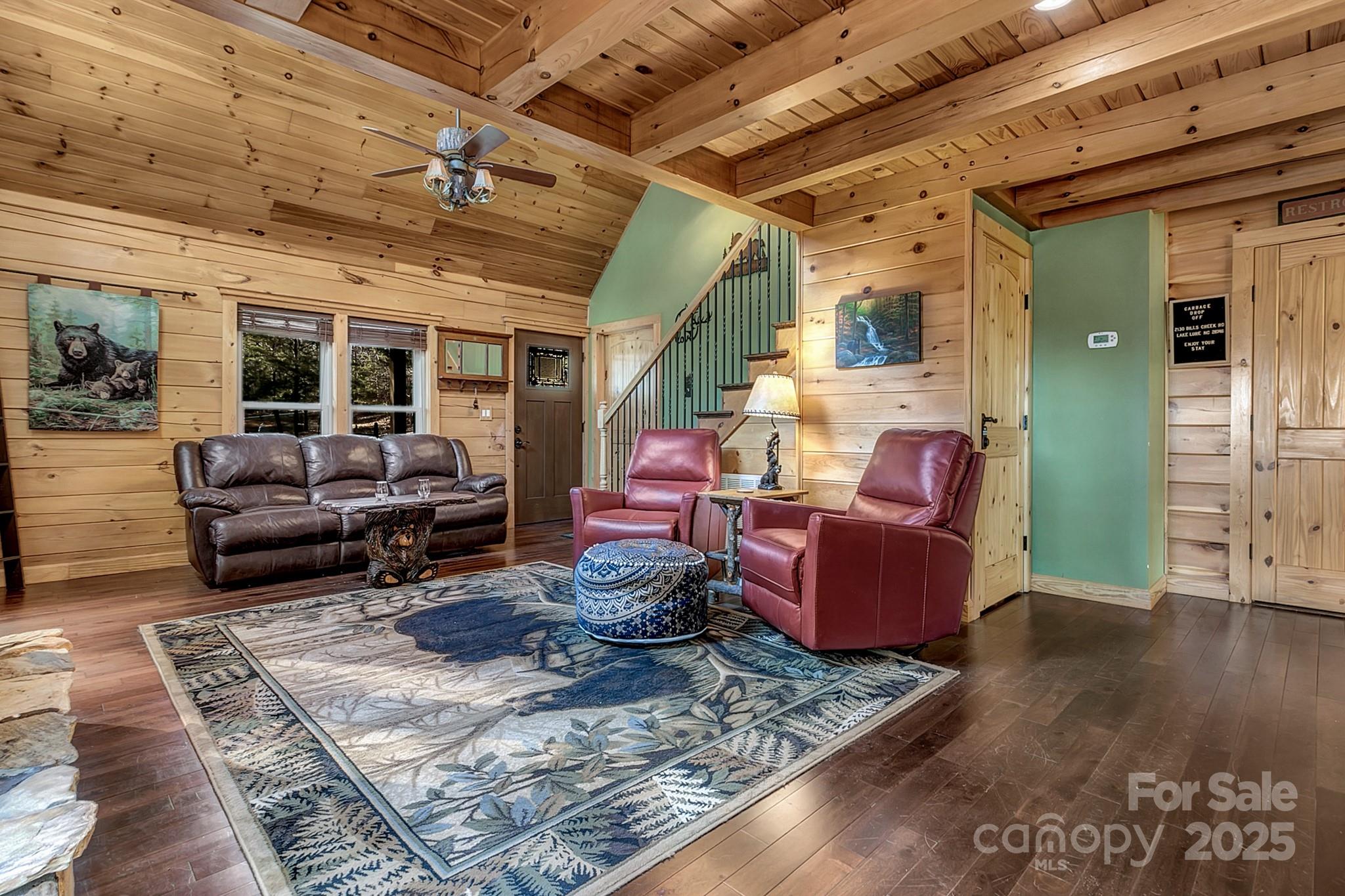 120 Sweetbriar Road North Lake Lure, NC 28746 - Photo 9 of 45 a living room with furniture and wooden floor