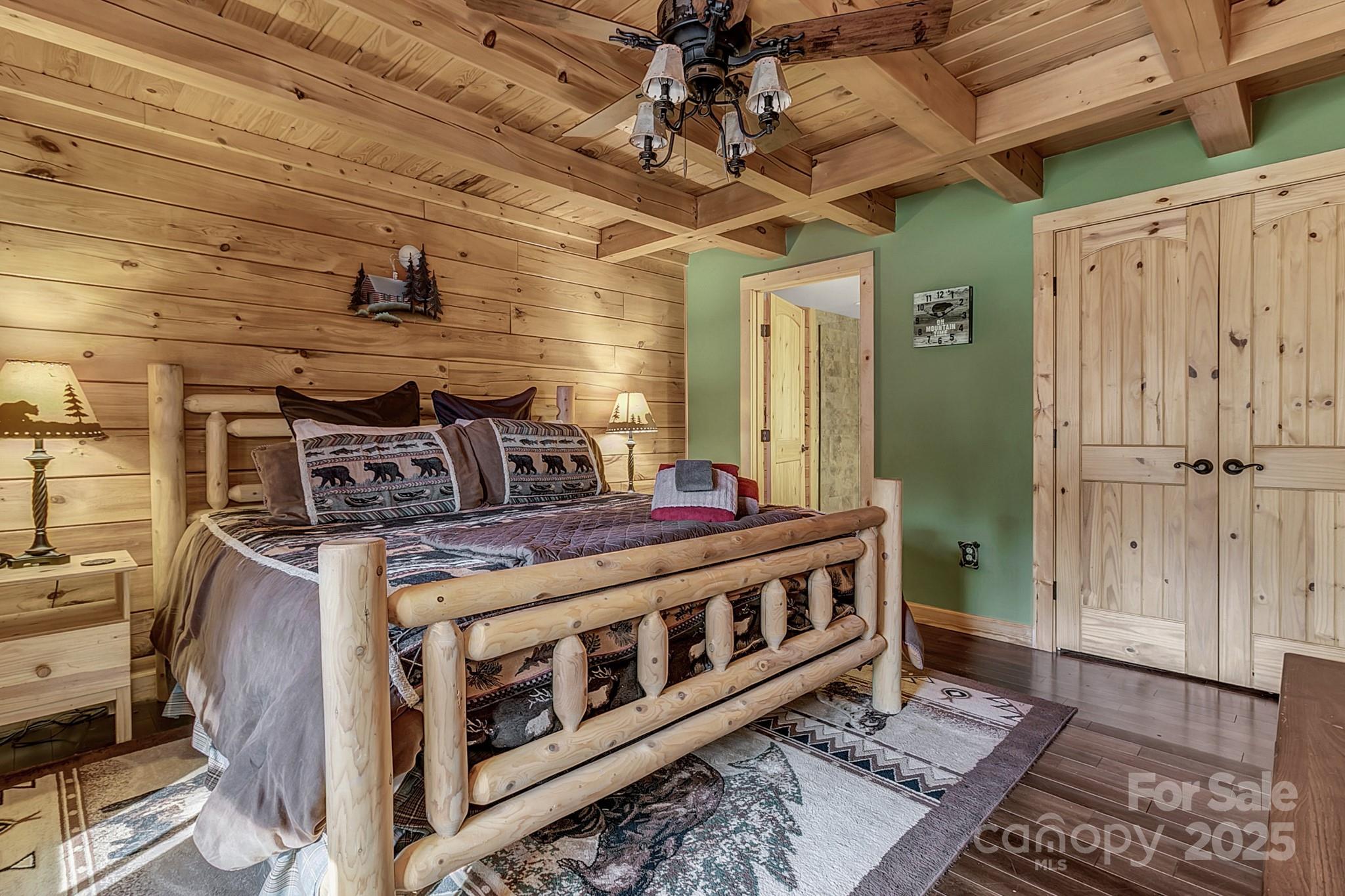 120 Sweetbriar Road North Lake Lure, NC 28746 - Photo 10 of 45 a bed room with a bed and a table