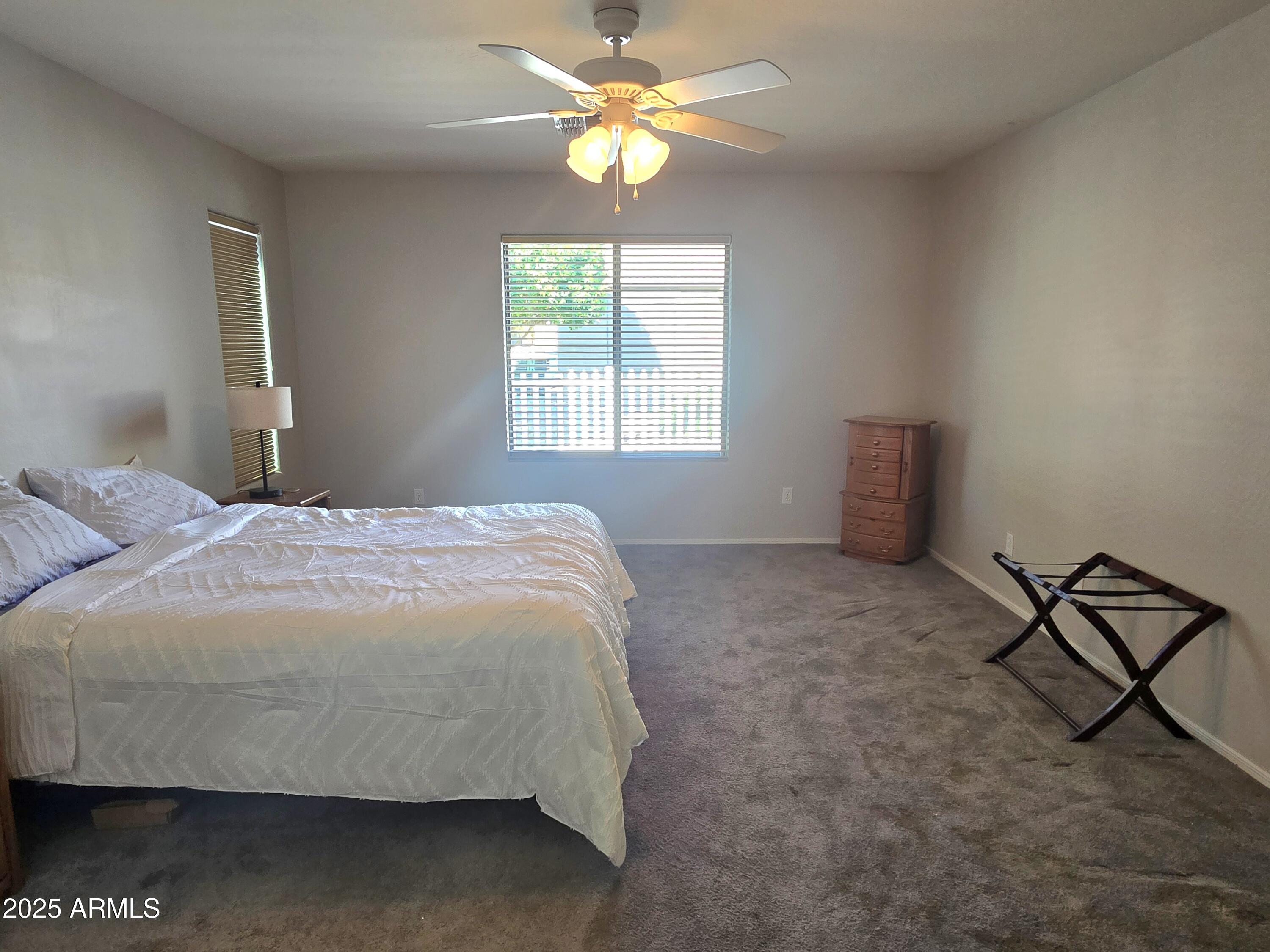 2101 South Meridian Road, Unit 274 Apache Junction, AZ 85120 - Photo 15 of 58 a bedroom with a bed and window