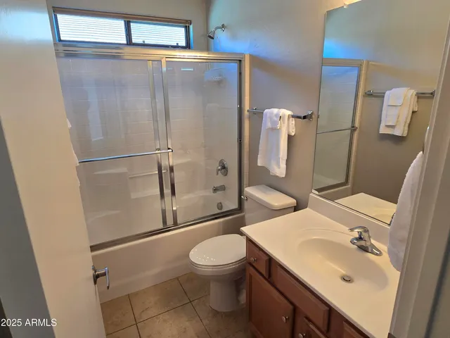 a bathroom with a sink toilet and mirror