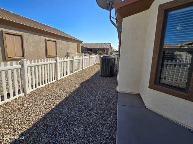 a view of a street with a sign board