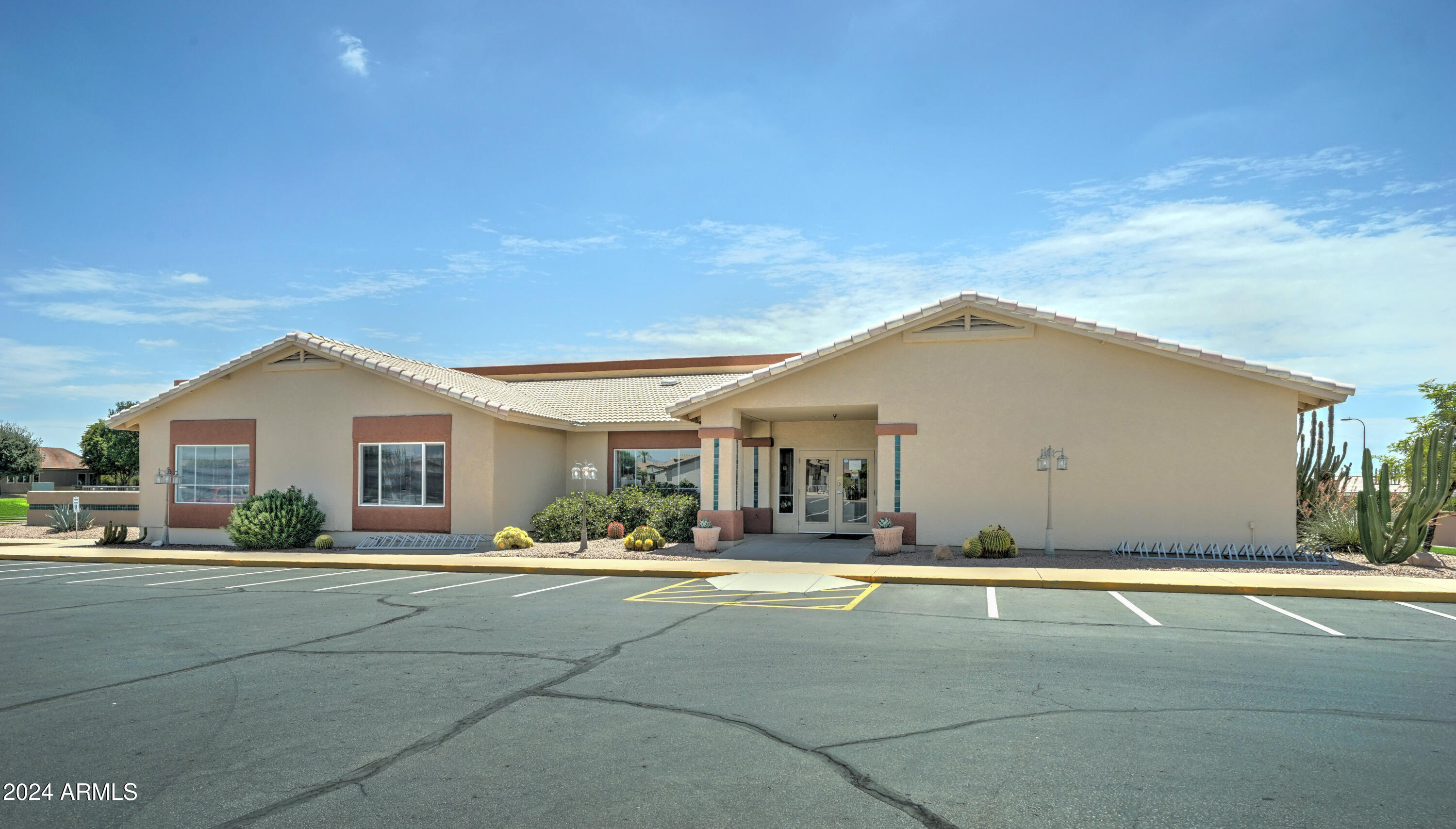 2101 South Meridian Road, Unit 274 Apache Junction, AZ 85120 - Photo 30 of 58 a front view of a house with a yard