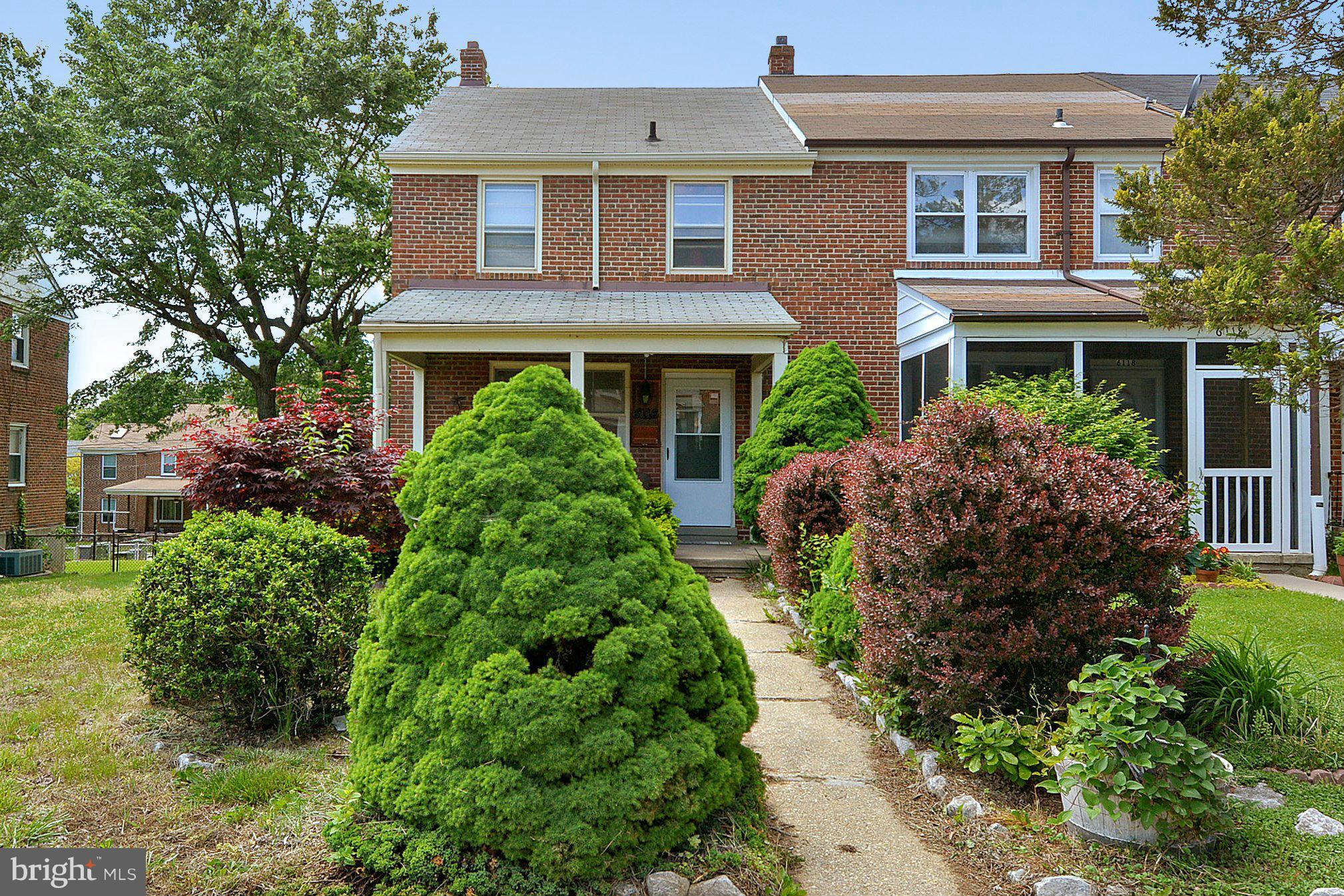 6116 Marlora Road Baltimore, MD 21239 - Photo 1 of 20 a front view of house with yard and green space