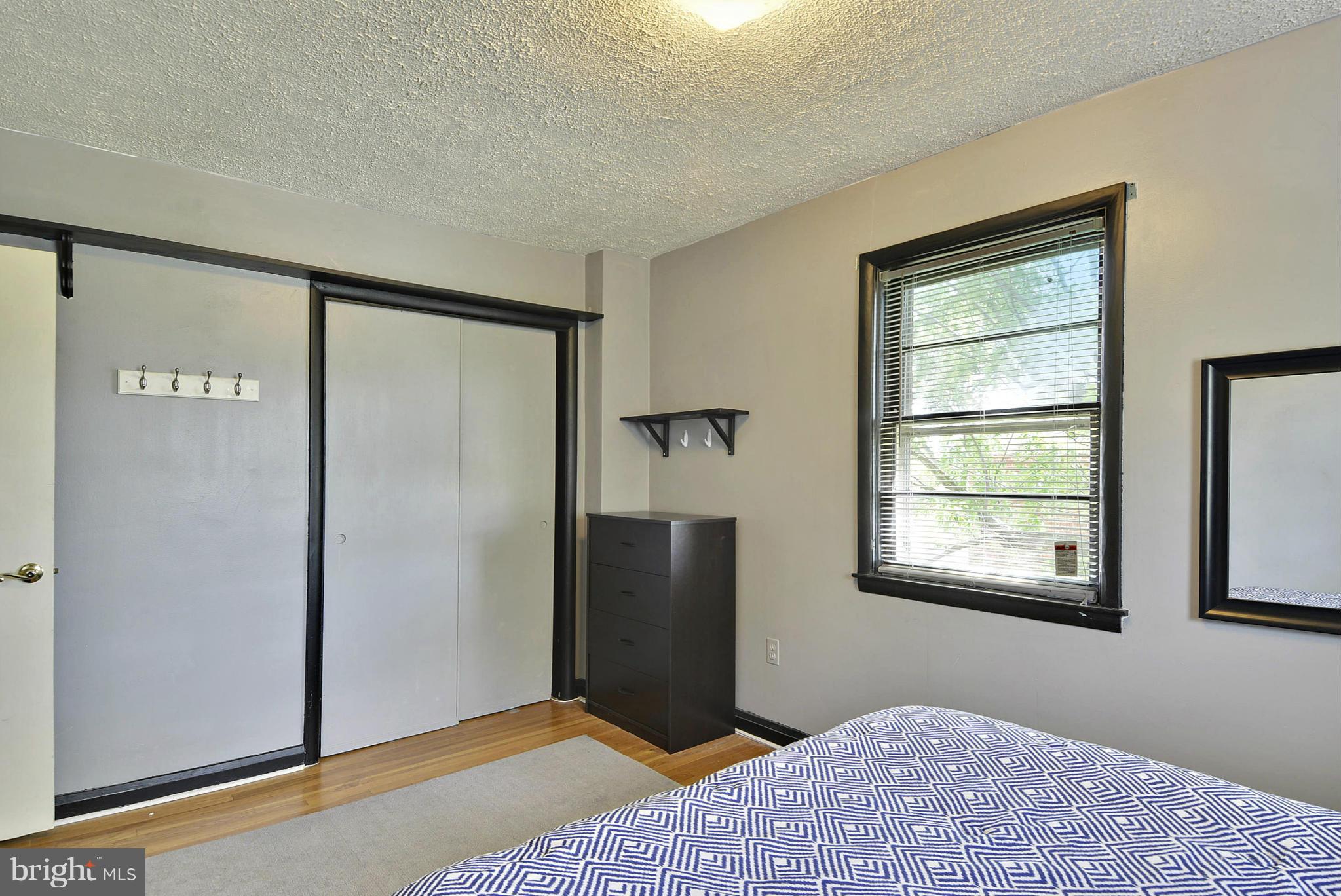6116 Marlora Road Baltimore, MD 21239 - Photo 18 of 20 a bedroom with a bed and a window