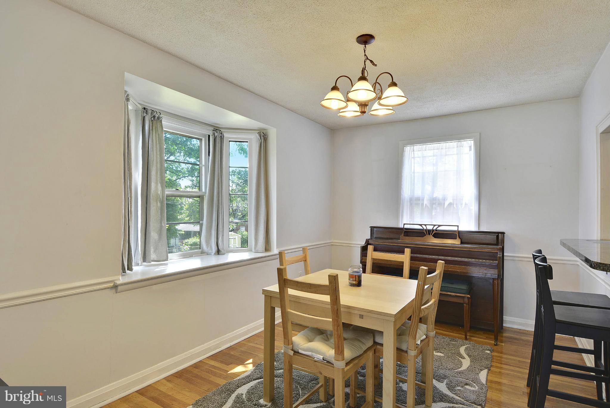6116 Marlora Road Baltimore, MD 21239 - Photo 6 of 20 a view of a dining room with furniture window and outside view