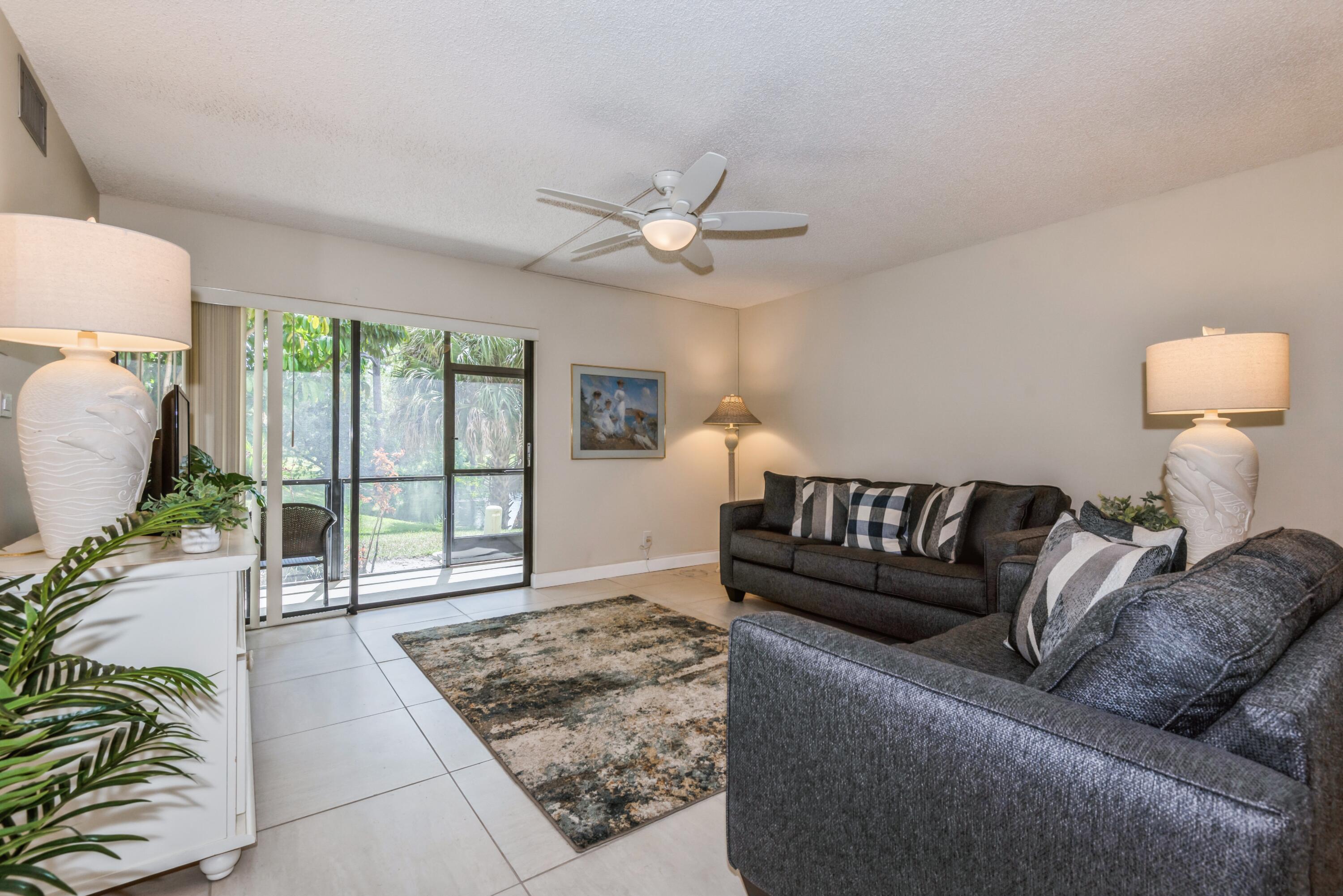 918 Southwest 9th St Circle, Unit 101 Boca Raton, FL 33486 - Photo 3 of 27 Living room/patio