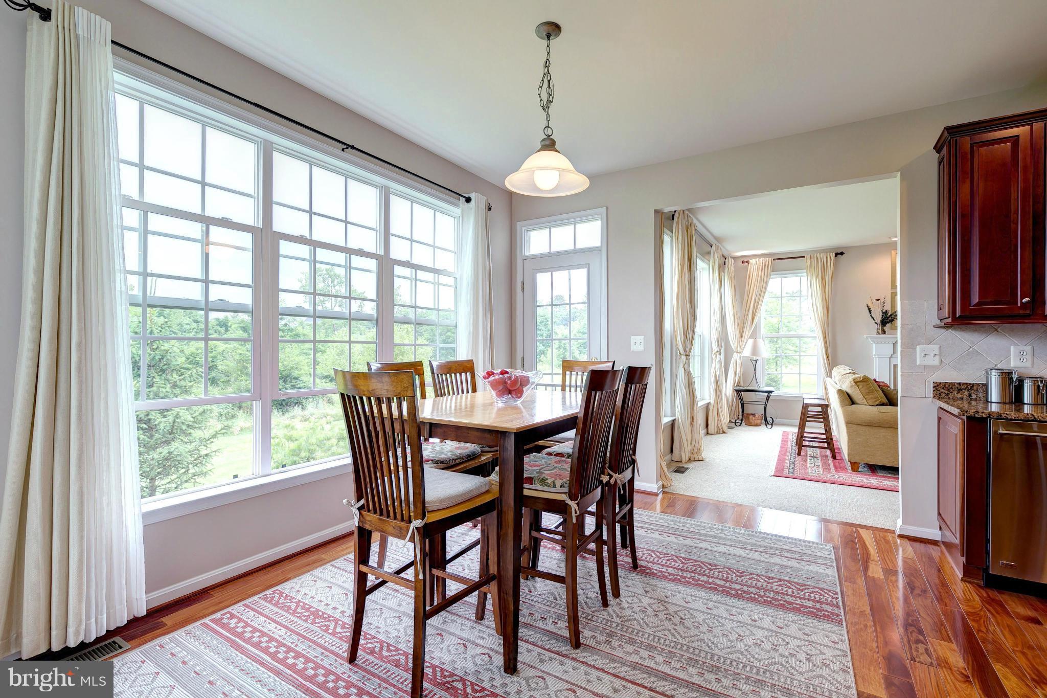 2014 Myrtlewood Road Baltimore, MD 21209 - Photo 12 of 30 a view of a dining room with furniture window and wooden floor