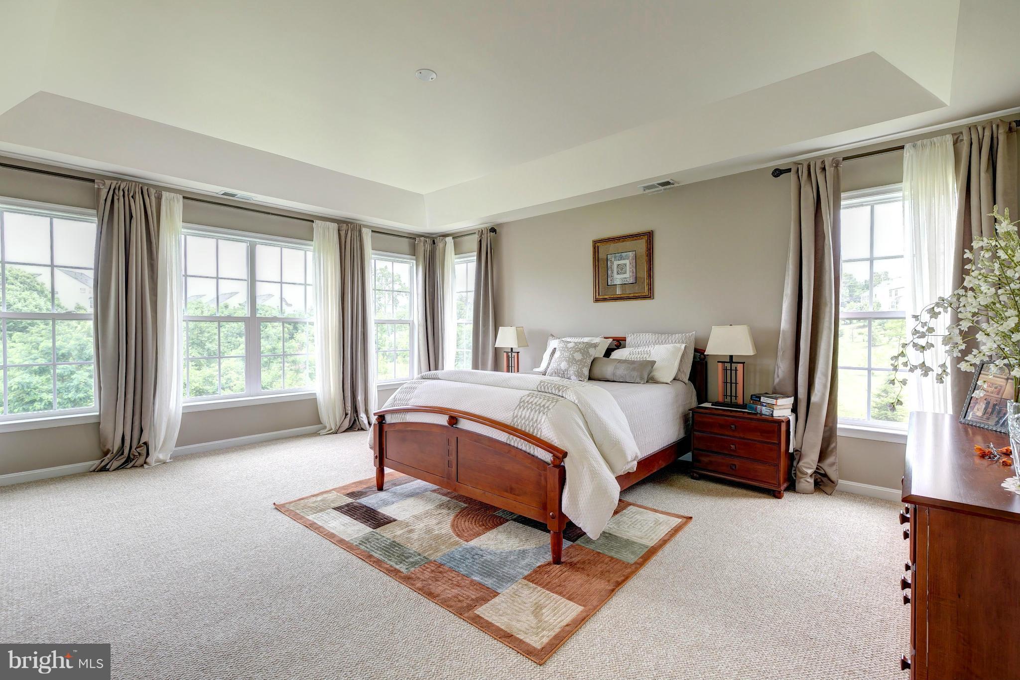 2014 Myrtlewood Road Baltimore, MD 21209 - Photo 15 of 30 a bedroom with a bed and glass window