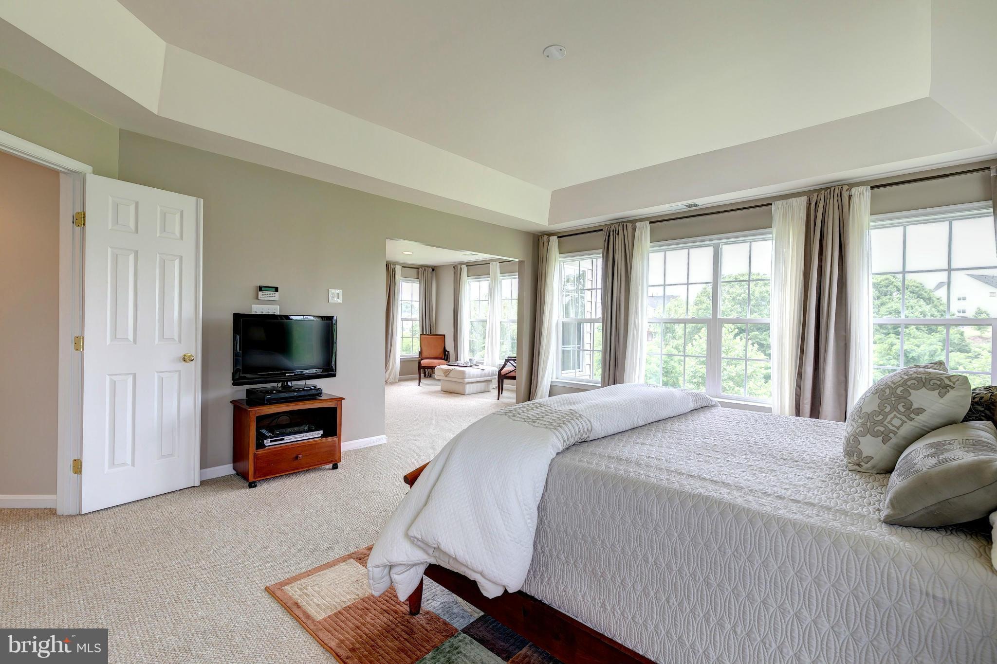 2014 Myrtlewood Road Baltimore, MD 21209 - Photo 16 of 30 a bedroom with a bed and a flat screen tv