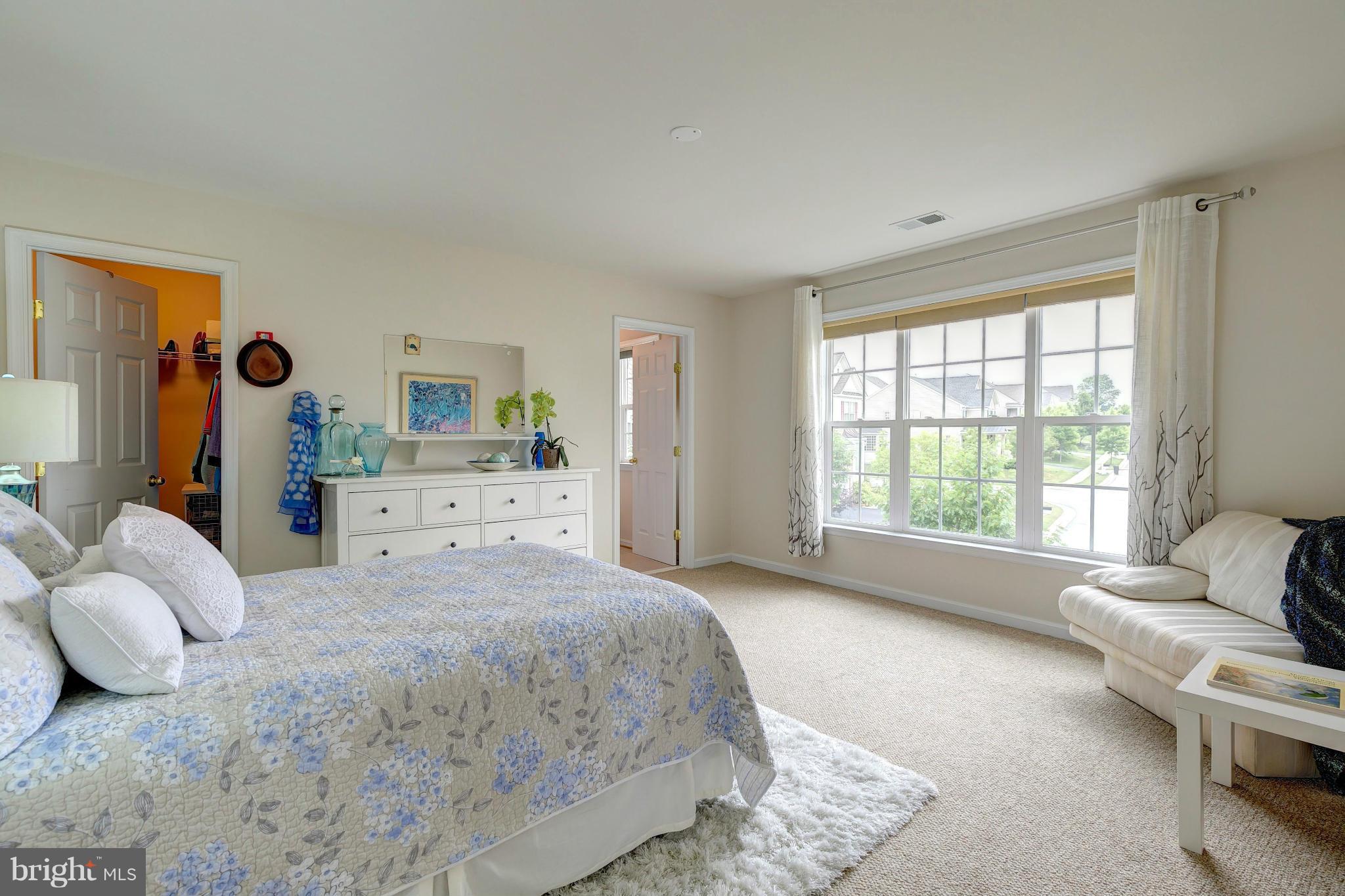 2014 Myrtlewood Road Baltimore, MD 21209 - Photo 19 of 30 a spacious bedroom with a bed and a couch