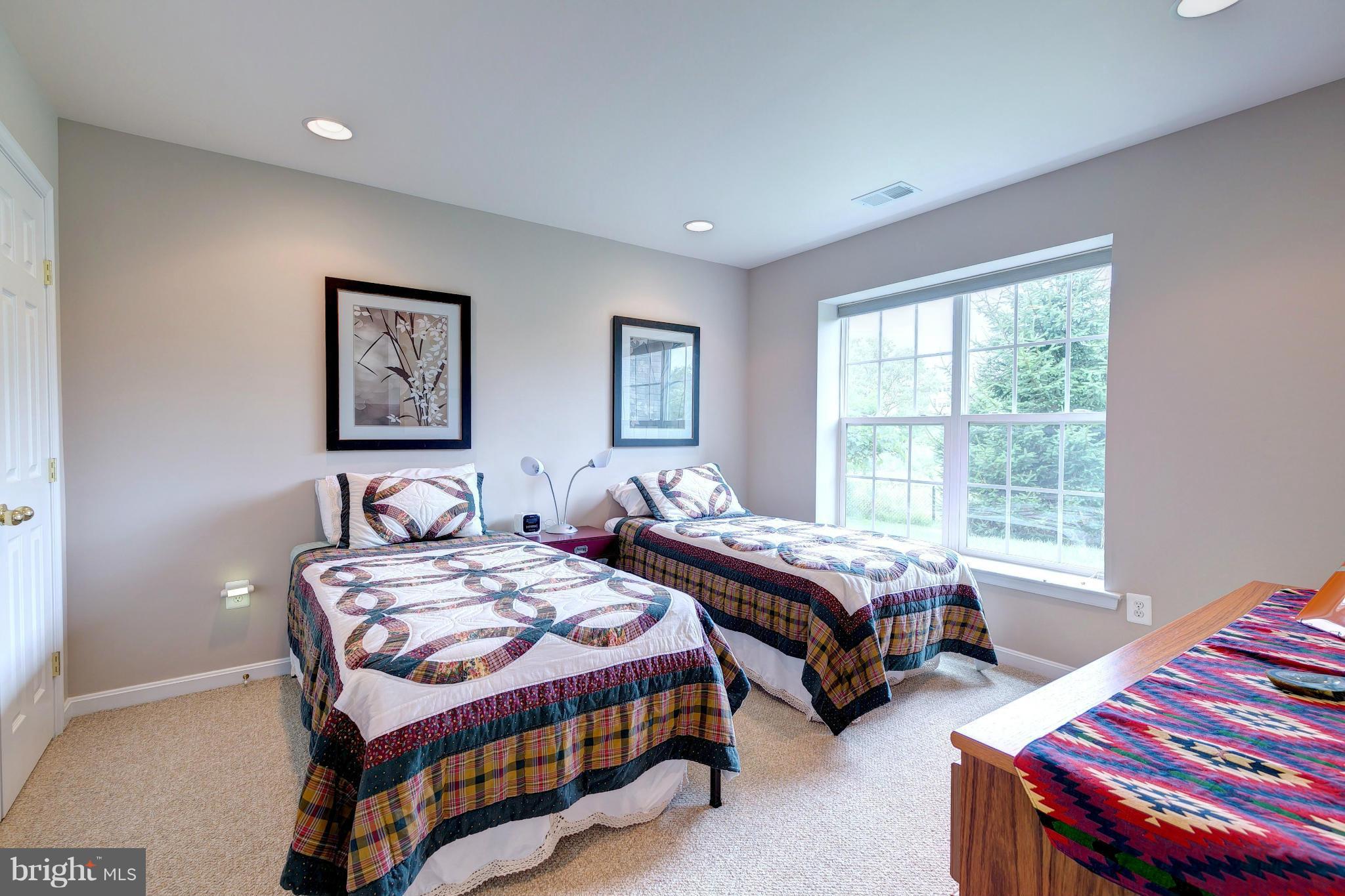 2014 Myrtlewood Road Baltimore, MD 21209 - Photo 27 of 30 a bedroom with two beds and a dresser with a window