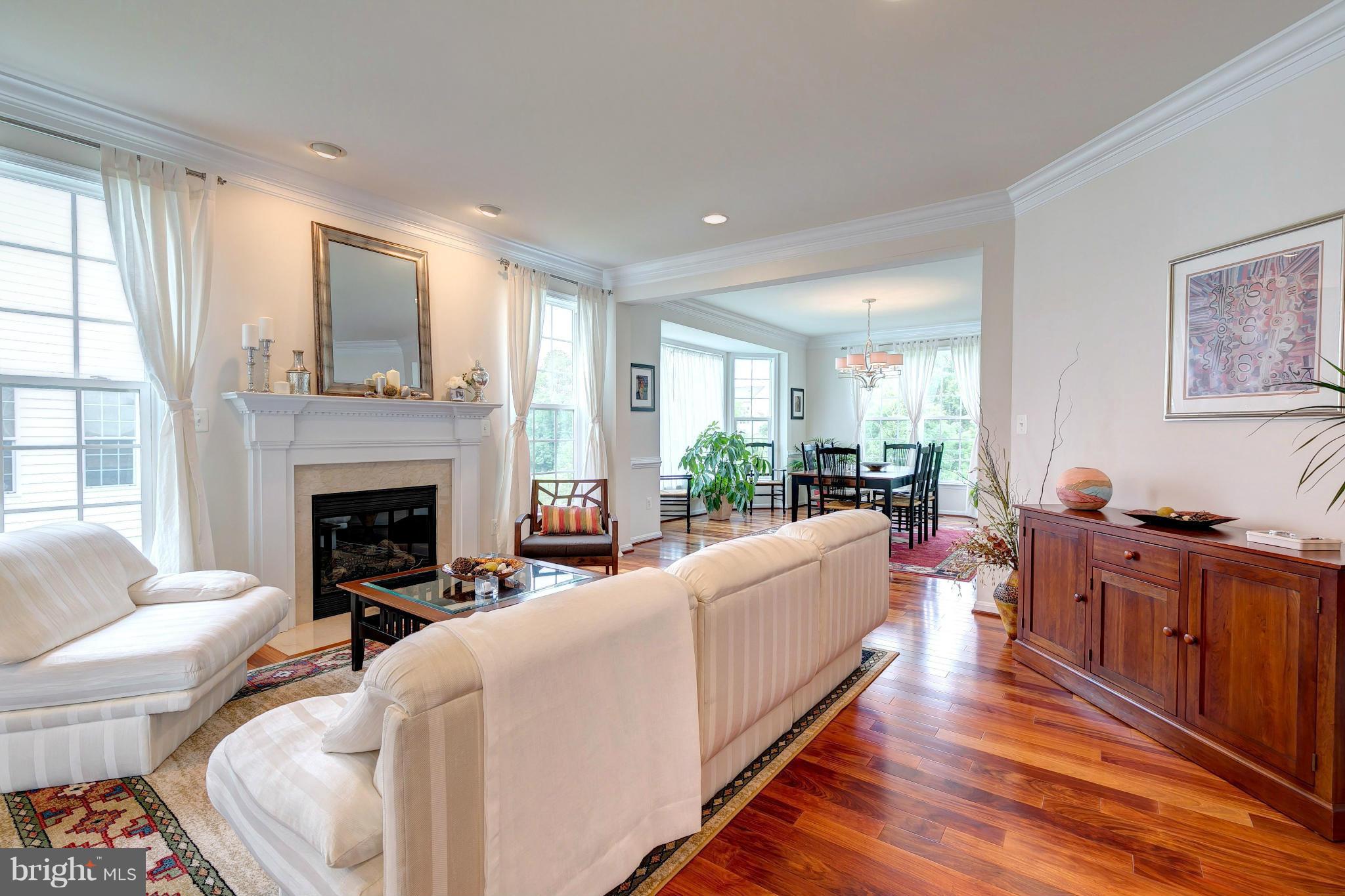 2014 Myrtlewood Road Baltimore, MD 21209 - Photo 5 of 30 a living room with furniture a fireplace and a large window