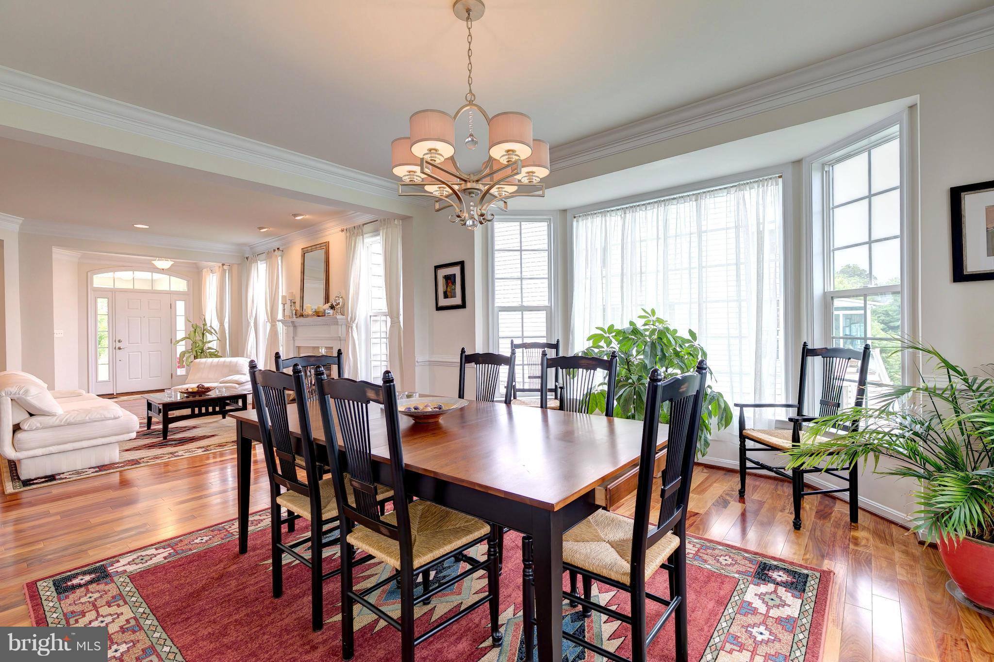 2014 Myrtlewood Road Baltimore, MD 21209 - Photo 7 of 30 a view of a dining room with furniture window and wooden floor