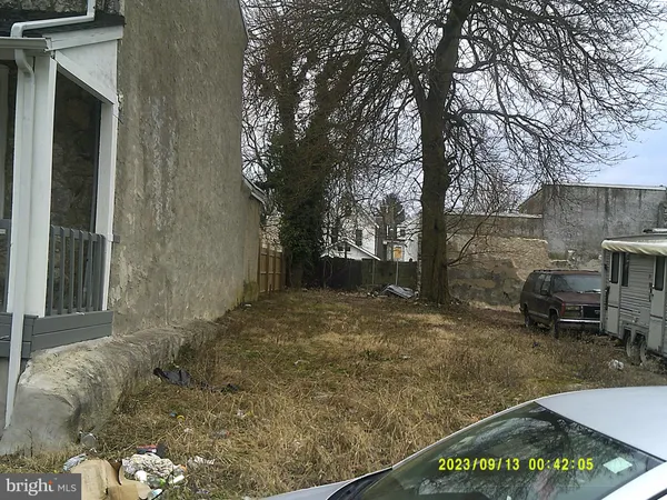 a view of a yard with an outdoor space