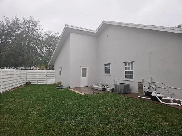 14763 Southwest 152nd Place Miami, FL 33196 - Photo 24 of 30 a backyard of a house with table and chairs