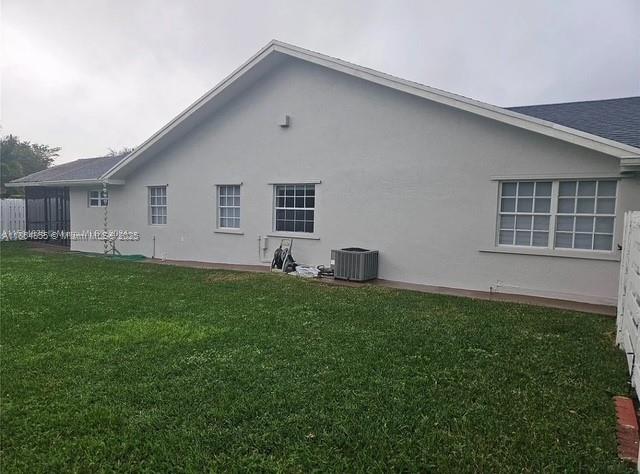14763 Southwest 152nd Place Miami, FL 33196 - Photo 25 of 30 a front view of house with yard and green space
