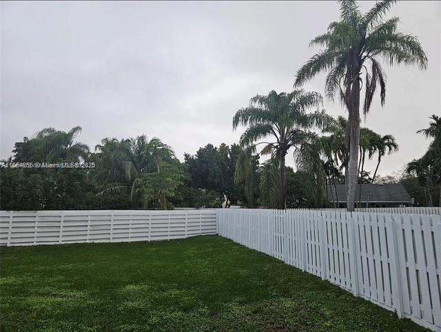 14763 Southwest 152nd Place Miami, FL 33196 - Photo 27 of 30 a view of a backyard with a palm tree