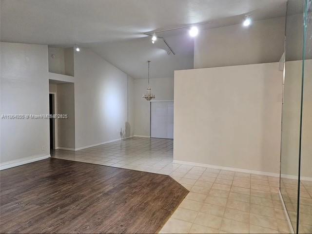 14763 Southwest 152nd Place Miami, FL 33196 - Photo 3 of 30 an empty room with wooden floor and windows